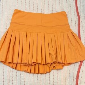 Vibrant Orange Pleated Mini Skirt